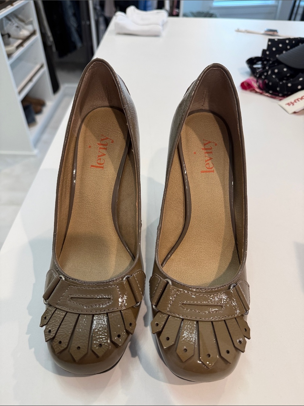 levity Taupe Patent Fringe Pumps